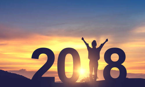 Silhouette young woman enjoying on the hill and 2018 years while celebrating new year